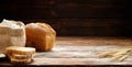 Freshly baked traditional bread on a wooden table. Royalty Free Stock Photo