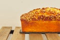 Freshly baked walnut loaf cake on a slate board