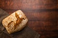 Freshly baked whole wheat bread on wrapped in a gray dishcloth. Royalty Free Stock Photo