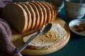 Freshly baked whole wheat brown bread on wood. Royalty Free Stock Photo