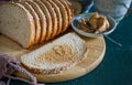 Freshly baked whole wheat brown bread on wood. Royalty Free Stock Photo