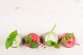 Freshly blended green and red fruit smoothie in glass jars with straw, mint leafs, top view. Royalty Free Stock Photo