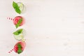 Freshly blended green and red fruit smoothie of strawberry and apple in glass jars with straw, mint leafs, top view. Royalty Free Stock Photo