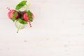 Freshly blended green and red fruit smoothie of strawberry and apple in glass jars with straw, mint leafs, top view. Royalty Free Stock Photo