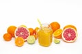 Freshly blended yellow and orange fruit smoothie in glass jar. Glass jar mugs with orange health smoothie, lime, grapefruit, lemon Royalty Free Stock Photo