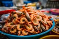 Freshly boiled shrimp displayed at vibrant fish market stall Royalty Free Stock Photo
