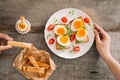 Freshly boiled white egg on wooden board. Healthy fitness breakfast