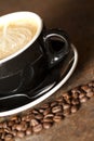 Cappuccino and Close Coffee Beans Royalty Free Stock Photo