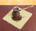 Freshly brewed coffee in old coffee pot and coffee beans Royalty Free Stock Photo