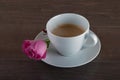 Freshly brewed coffee served with beautiful rose flowers. Royalty Free Stock Photo