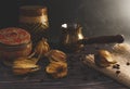 Freshly brewed hot coffee with steam in traditional turkish cezve. Physalis and coffee beans lie on the wooden vintage table. Royalty Free Stock Photo