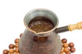 Freshly brewed Turkish coffee in old copper coffee pot closeup Royalty Free Stock Photo