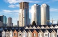 Brand new townhouses in a row on bright sunny day with Highrises in the background. Royalty Free Stock Photo