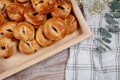 Freshly bun with raisins on a wooden table. Closeup