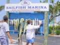 A row of fish hanging under Sailfish Marina sign, Florida Royalty Free Stock Photo