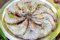 Freshly caught shrimp on a round iron platter, close-up. King prawns in a shell before cooking. Seafood restaurant Royalty Free Stock Photo