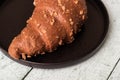 Freshly chocolate croissant on plate Royalty Free Stock Photo