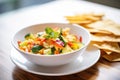 freshly chopped vegetables with crispy pita on a white bowl Royalty Free Stock Photo