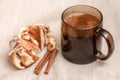 Freshly cinnabon French bun with cinnamon and coffee, selective focus Royalty Free Stock Photo