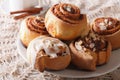 Freshly cinnamon rolls with almond close up and coffee. horizontal