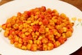 Freshly collected Cloudberries Rubus chamaemorus on white plate. ripe cloudberry