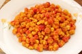 Freshly collected Cloudberries Rubus chamaemorus on white plate. ripe cloudberry