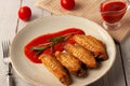 Buffolo wings with tomato sauce and rosemary sprig