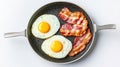 Freshly Cooked Eggs and Crispy Bacon in Nonstick Frying Pan on White Surface Royalty Free Stock Photo