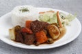 Freshly cooked Filipino food called Beef Caldereta or beef with vegetables in tomato sauce