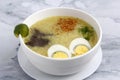 Freshly cooked Filipino food called goto or lugaw or rice porridge topped with meat and egg Royalty Free Stock Photo