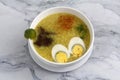 Freshly cooked Filipino food called goto or lugaw or rice porridge topped with meat and egg Royalty Free Stock Photo