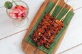 Freshly cooked Filipino food called Isaw or grilled chicken intestine in barbecue sticks