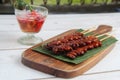Freshly cooked Filipino food called Isaw or grilled chicken intestine in barbecue sticks