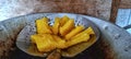 Freshly cooked fried cassava on a frying pan