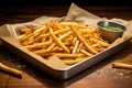 freshly cooked fries on a paper-lined tray