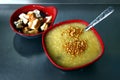 Freshly cooked Goto or rice porridge with beef innards and bowl of fried tofu