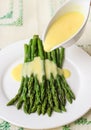 Freshly cooked green asparagus with hollandaise sauce Royalty Free Stock Photo