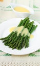 Freshly cooked green asparagus with hollandaise sauce Royalty Free Stock Photo