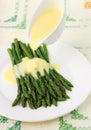 Freshly cooked green asparagus with hollandaise sauce Royalty Free Stock Photo