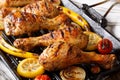 Freshly cooked grilled chicken drumstick legs with vegetables in Royalty Free Stock Photo