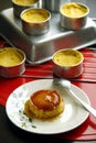 Freshly cooked Leche Flan on a table Royalty Free Stock Photo