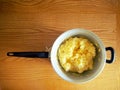 Freshly cooked polenta inside the pot waiting to be served. Polenta is an ancient dish of boiled cornmeal.