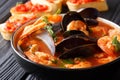 Freshly cooked seafood bouillabaisse soup with shrimps, fish fil