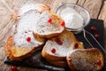 Freshly cooked sweet Rabanadas toast with powdered sugar and berries close up. horizontal Royalty Free Stock Photo