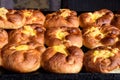 Freshly cooked traditional salted cheese pies called `poale in brau` in display for sale at a weekend street food market in Buchar