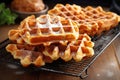 freshly cooked waffles on a cooling rack