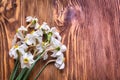 Freshly cut bunch of white narcissi on a wooden table.
