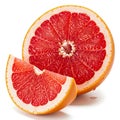 Freshly cut grapefruit half with a segment removed isolated on white background Royalty Free Stock Photo