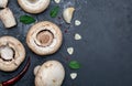 Freshly cut mushrooms mushrooms, sliced feet, Bisporus agaricus raw uncooked, with garlic, chillies, pink pepper, oregano. Royalty Free Stock Photo
