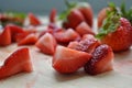 Freshly Cut Strawberries on Wooden Plate